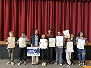 County Executive Sue Serino and all the honorees taking a picture with their certificates and yard signs