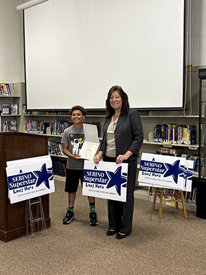 County Executive Sue Serino and taking picture with honoree with their certificate and yard sign