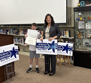 County Executive Sue Serino and taking picture with honoree with their certificate and yard sign