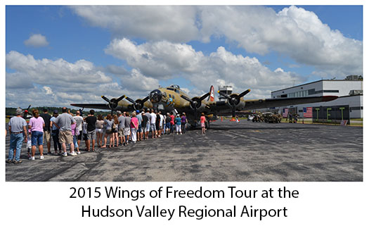 Visitor looking at Wings for Freedom Tour plane