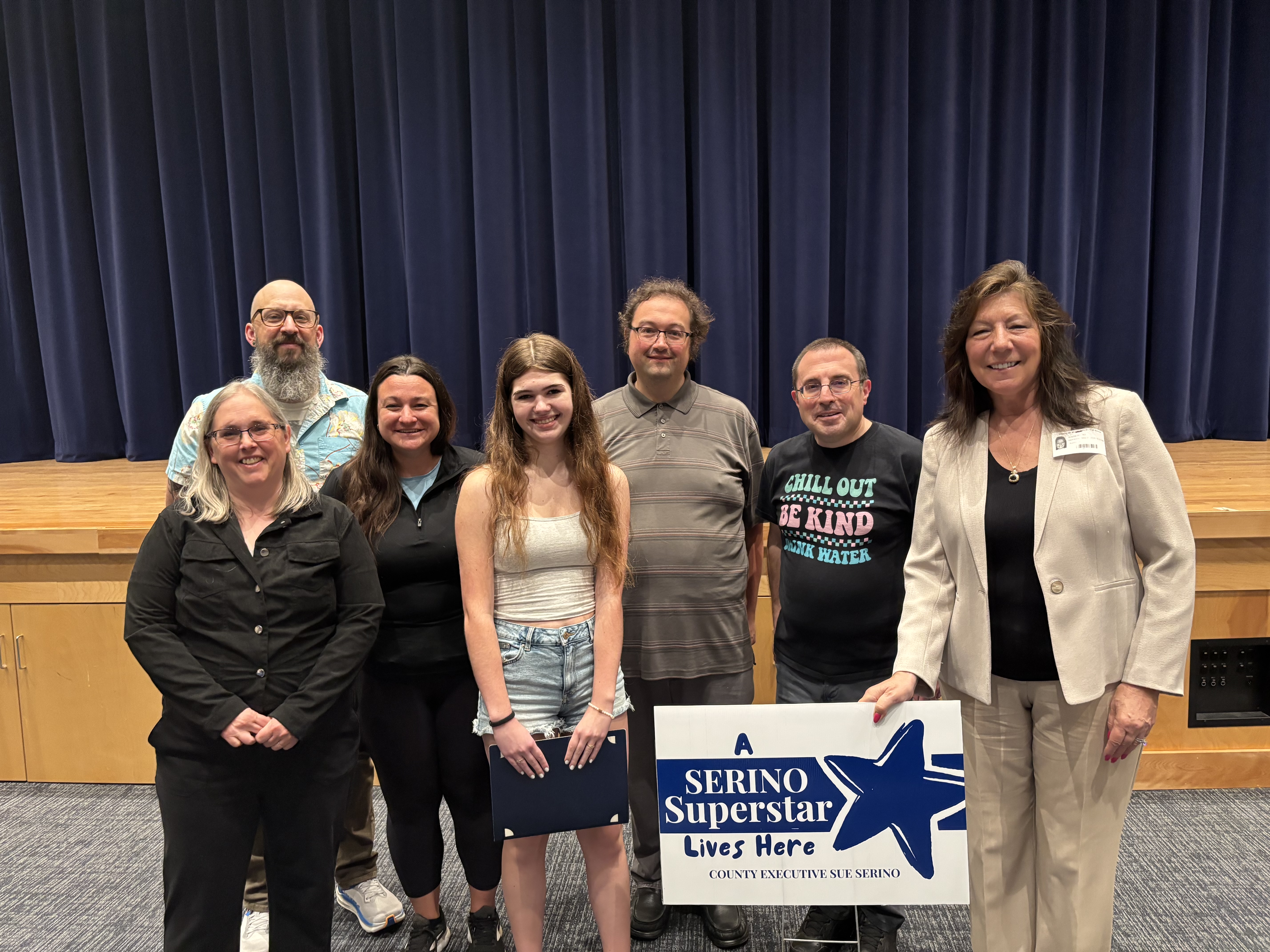 County Executive Sue Serino and teachers taking picture with honoree