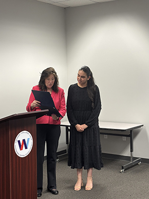 County Executive Sue Serino presenting certificate to honoree
