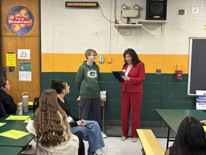 County Executive Sue Serino reading certificate to honore