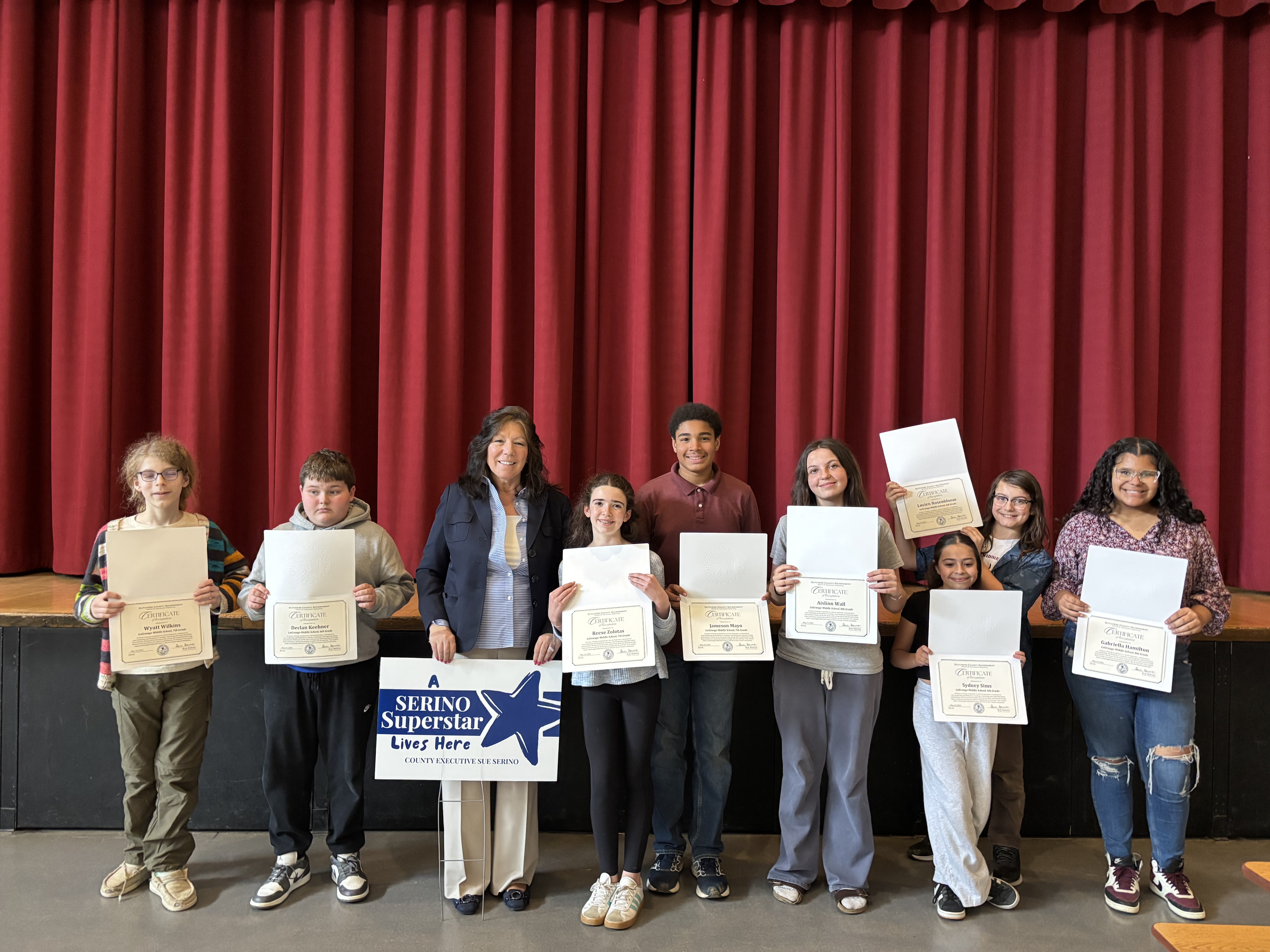 Sue Serino and all the ‘Serino Superstar’ nominees from LaGrange with their certificates and yard sign