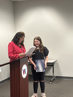 County Executive Sue Serino presenting certificate to honoree