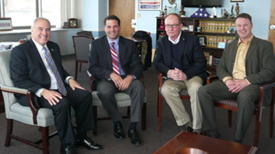 County Executive Molinaro sitting with NYS Comptroller DiNapoli, Chairman Rolison and County Comptroller Coughlan