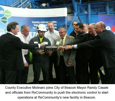 County Executive Molinaro with Beacon officials pusing electronic control to start operations at ReCommunity