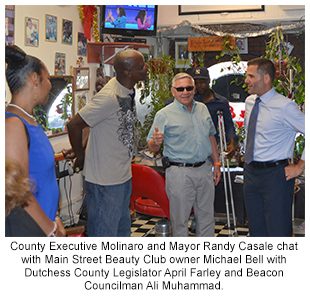 County Executive Molinaro with Beacon officials and business owner