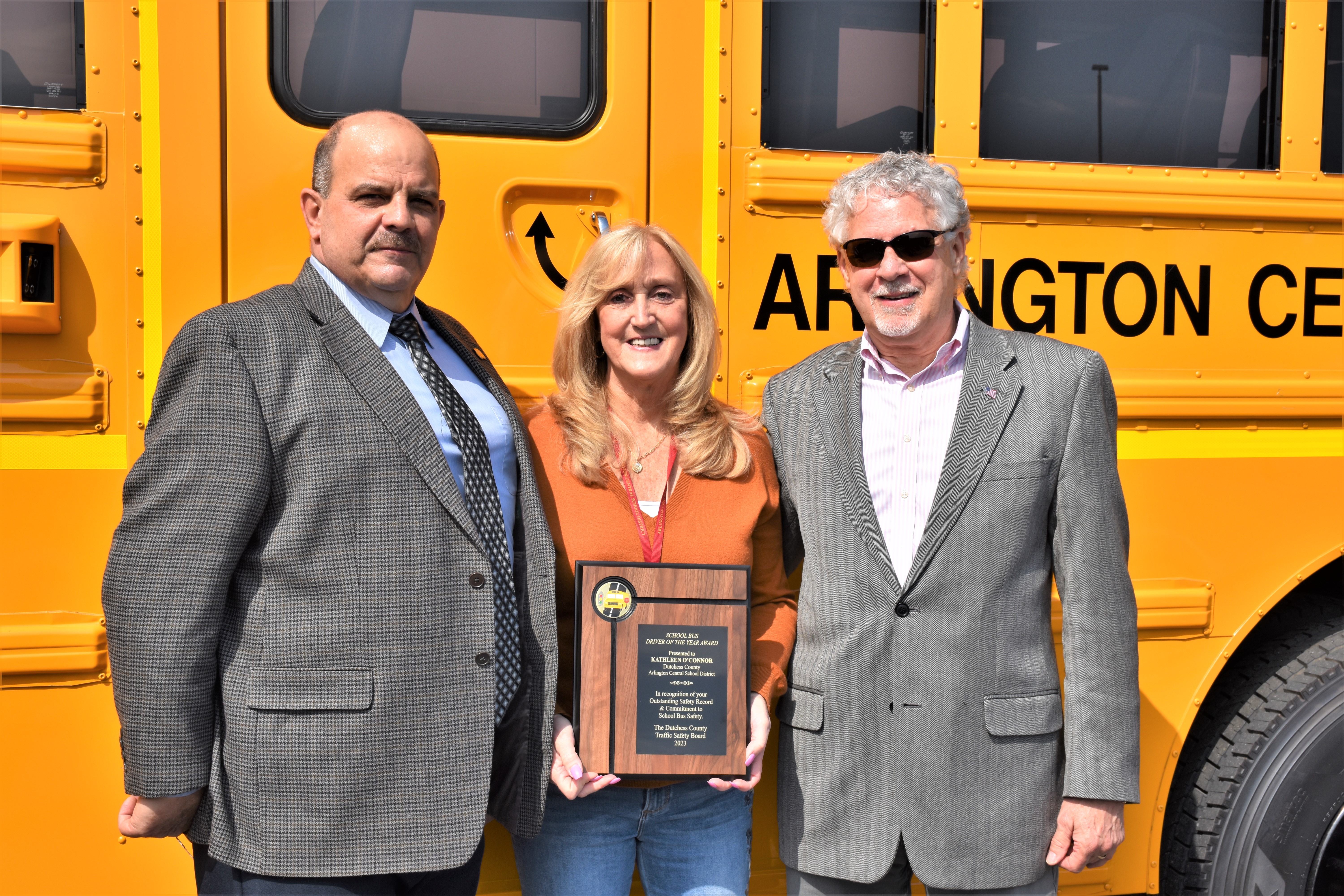 Kathleen O'Connor, middle, 2023 School Bus Driver of the Year from Arlington Central School District