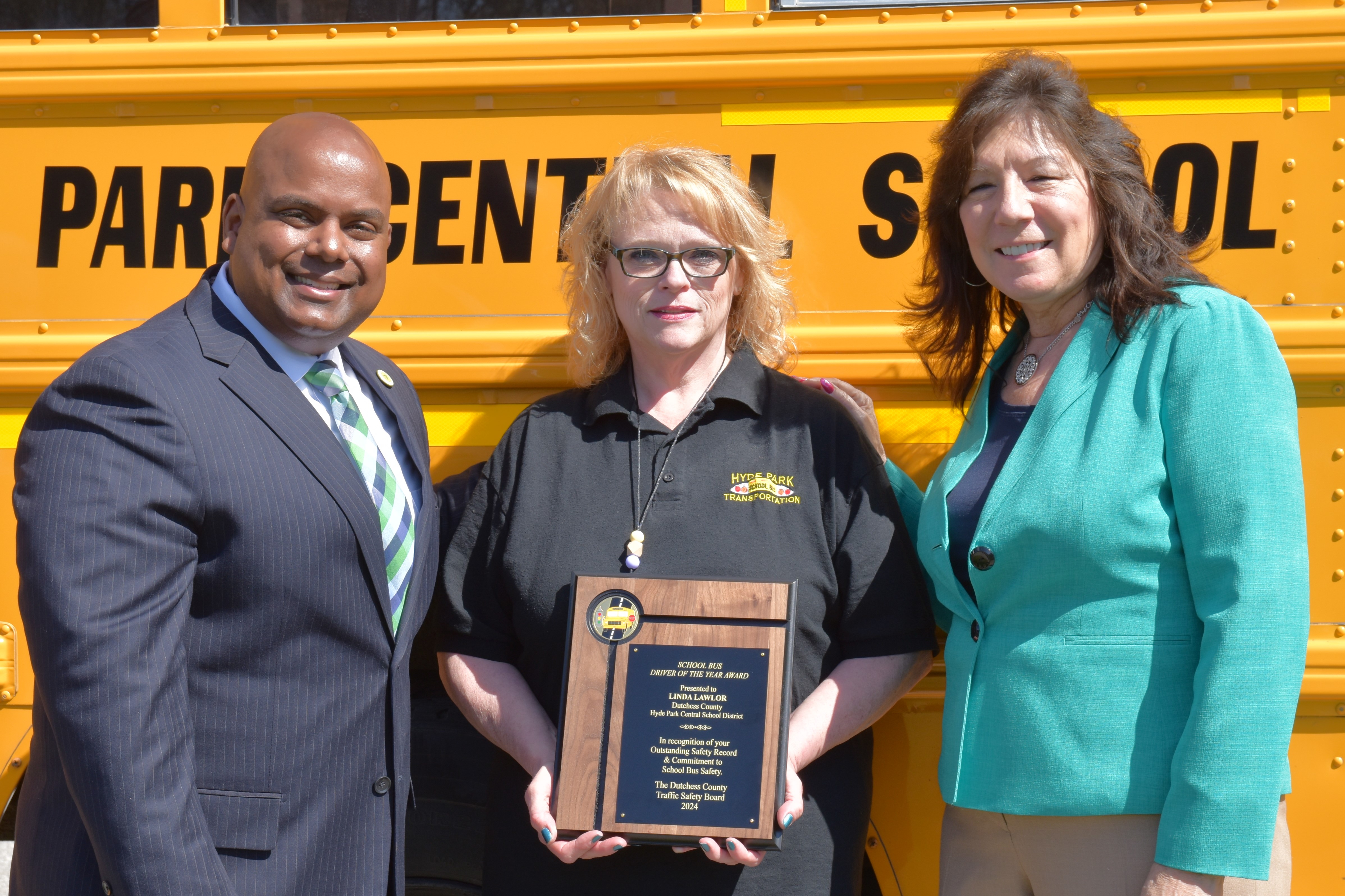 Linda :Lawlor, middle, 2024 School Bus Driver of the Year honoree
