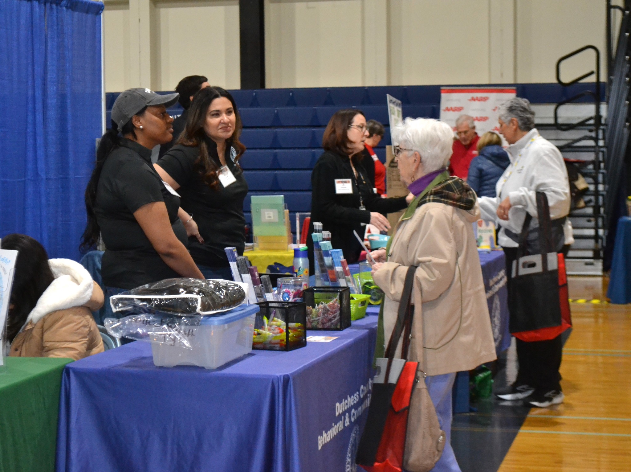 people talking at health fair
